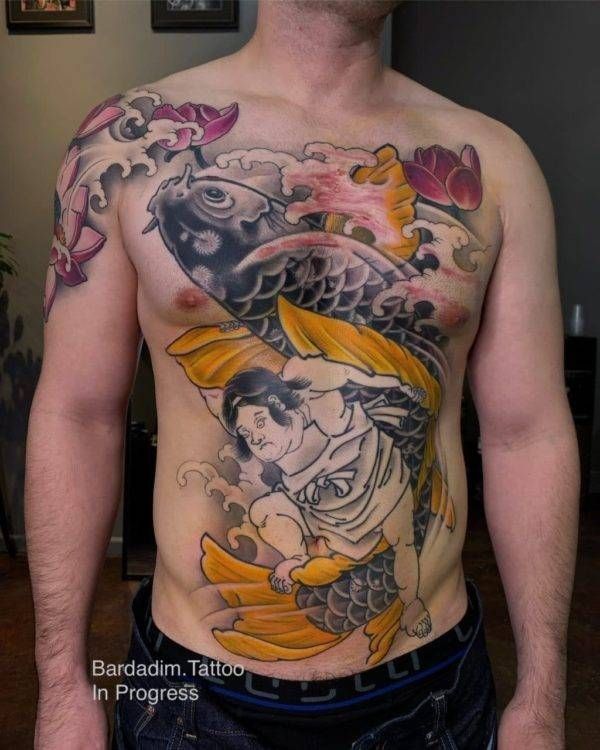 A man with a tattoo on his chest that says bardadim tattoo in progress