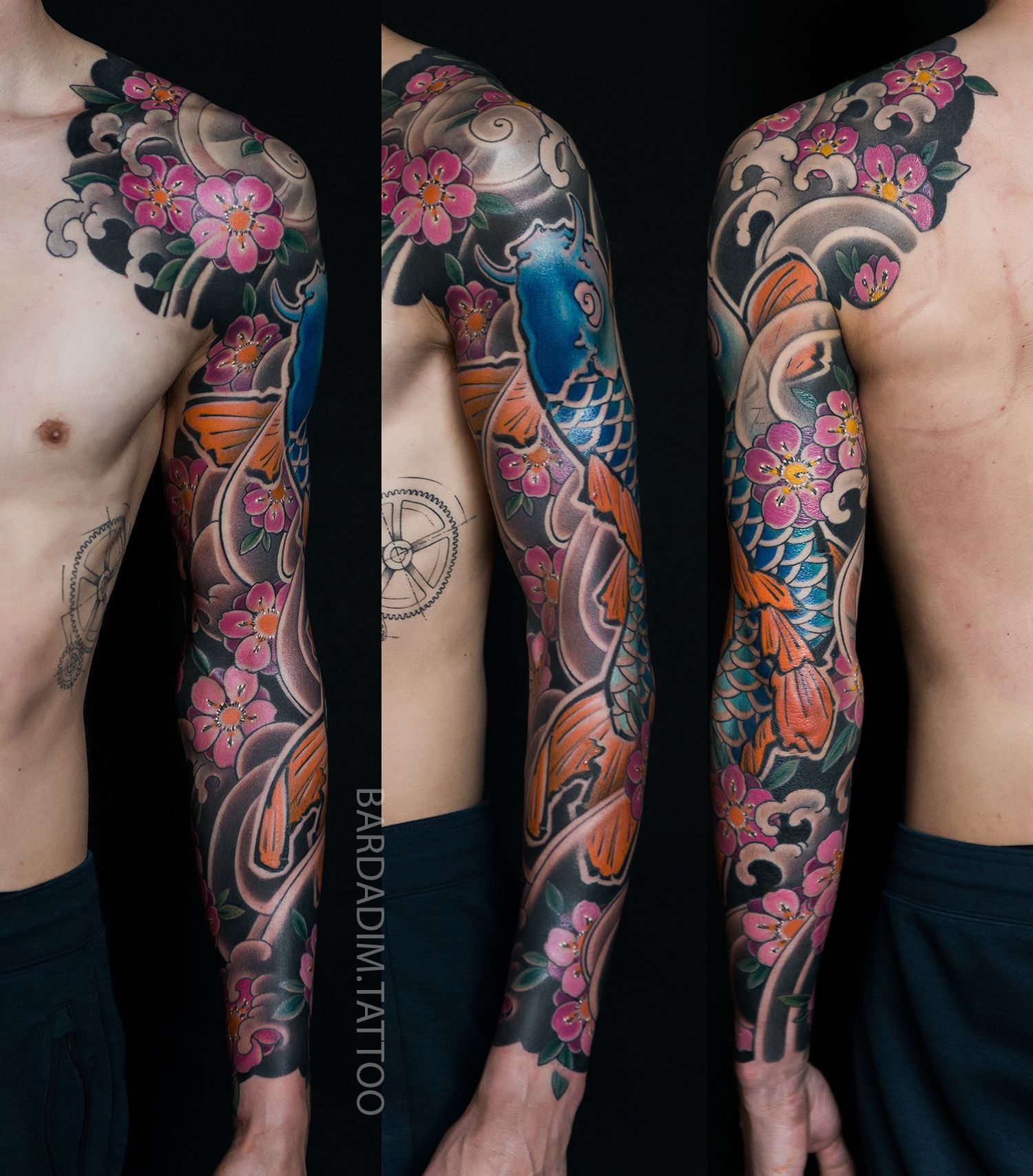 Tattoo sleeve featuring koi fish, cherry blossoms, and waves on a person's arm and shoulder, against a dark background.