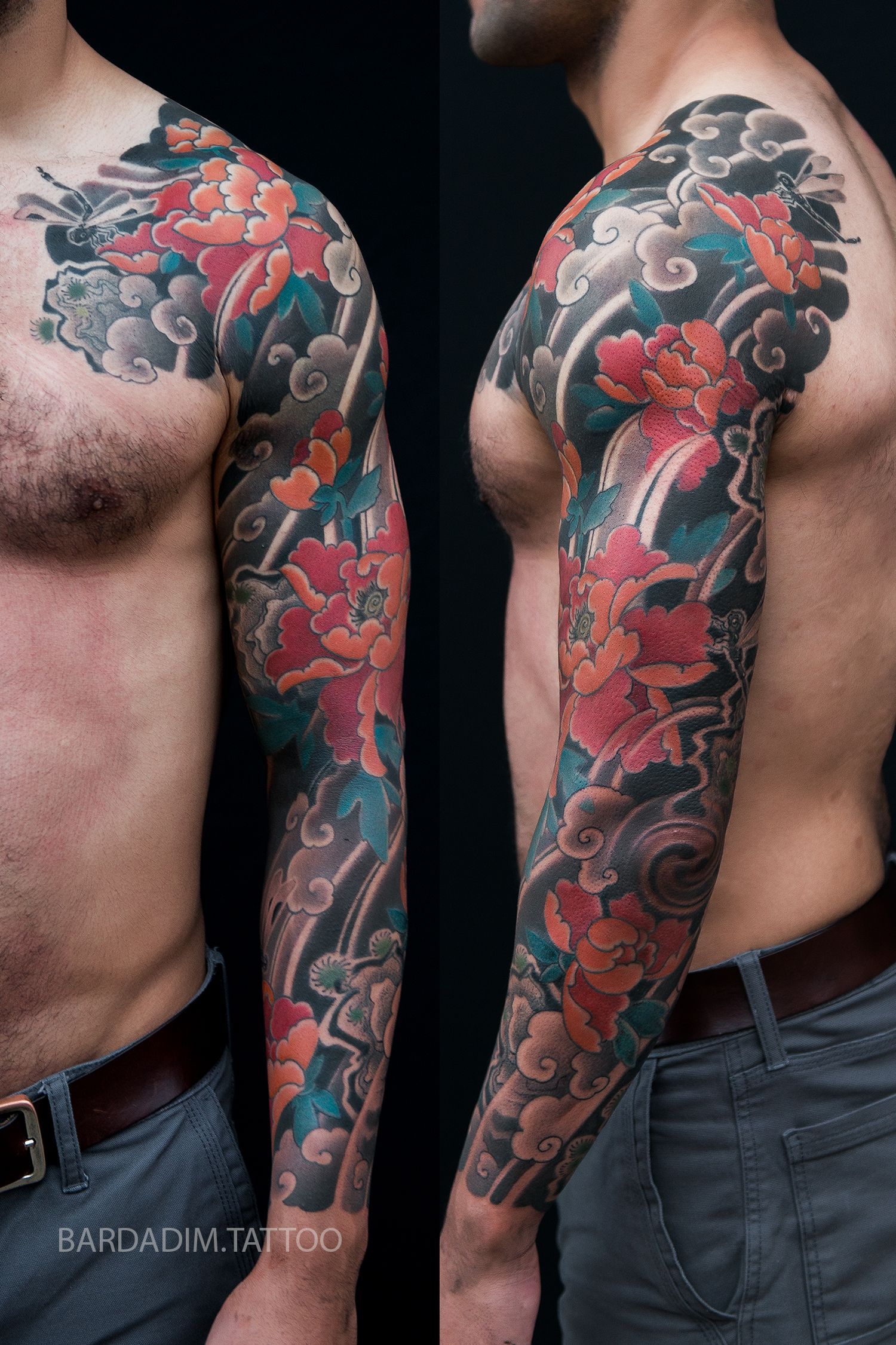 Man with full sleeve tattoo of colorful peonies and clouds.