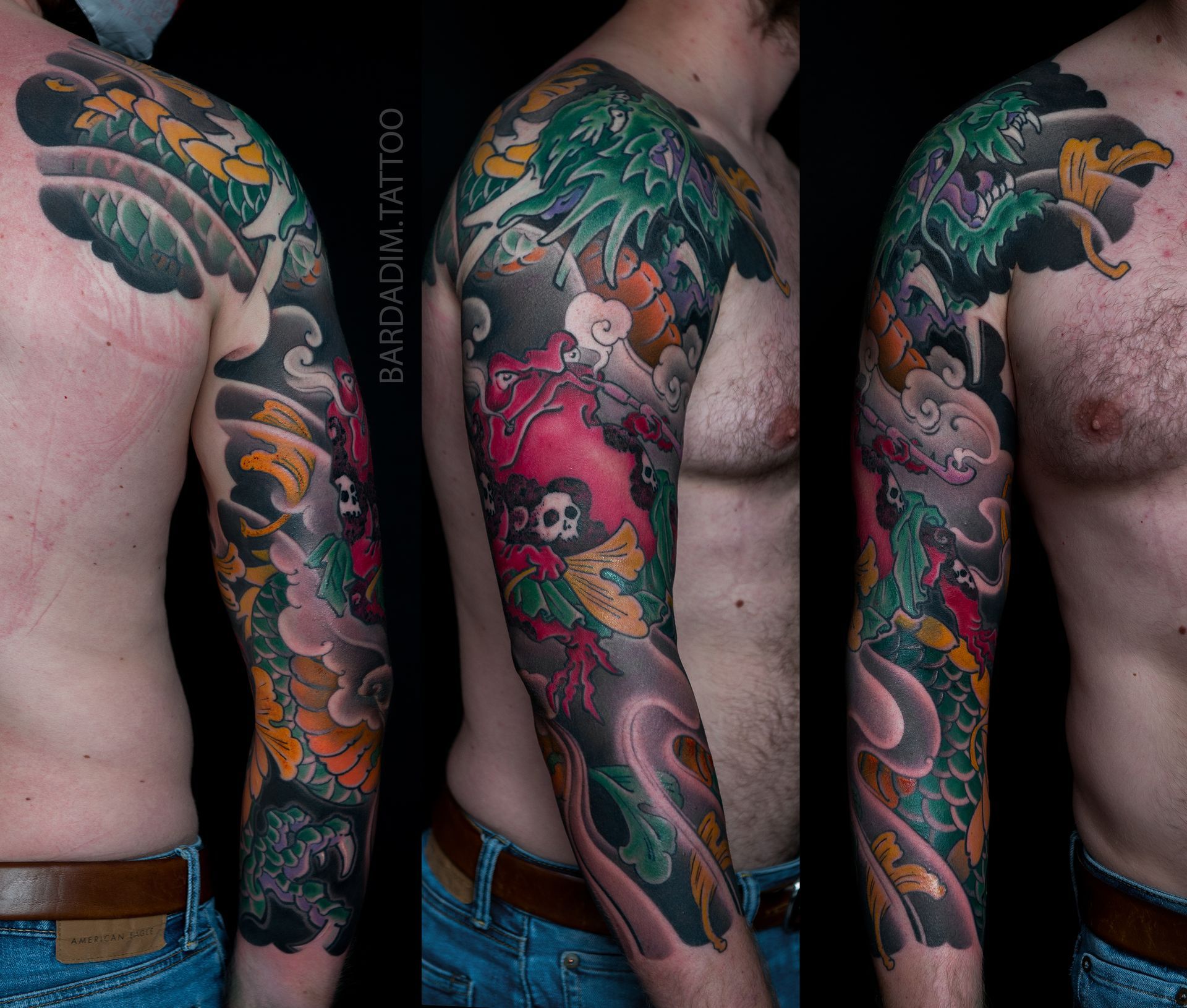 Man with full sleeve tattoo featuring a dragon, clouds, and floral elements in green, red, yellow and black.