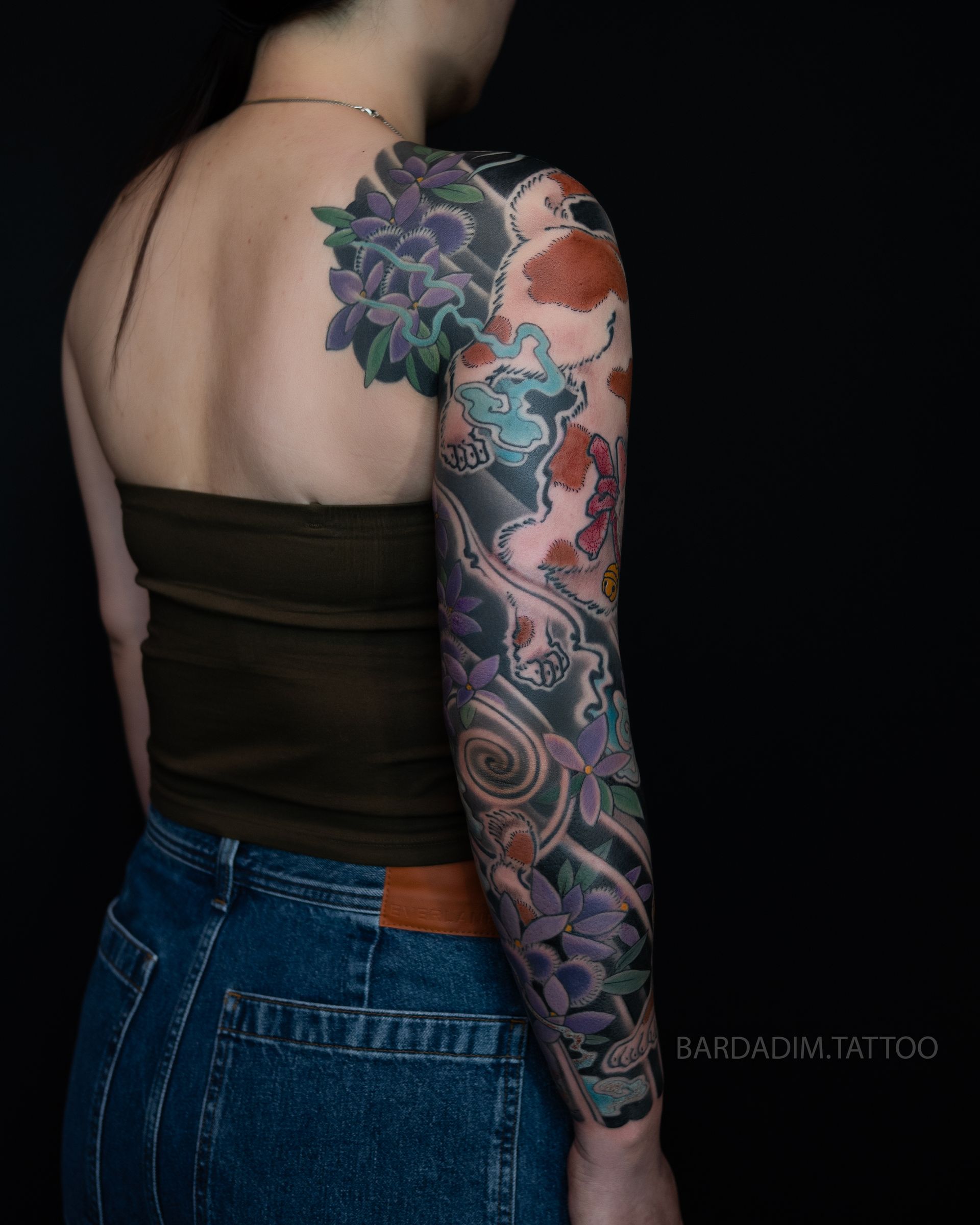 Japanese full sleeve tattoo back view with twin monster cats, fireballs, and yama-ajisai hydrangea