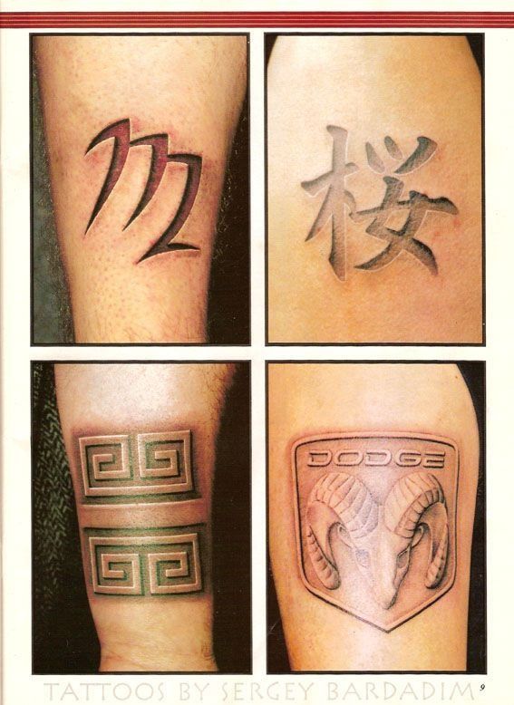 A tattoo of a dodge logo on a person 's arm