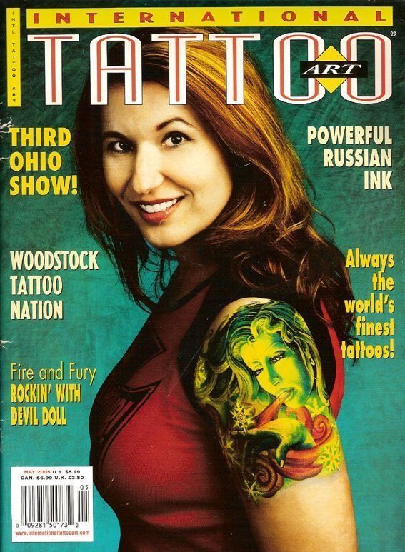A woman with a tattoo on her arm is on the cover of an international tattoo art magazine
