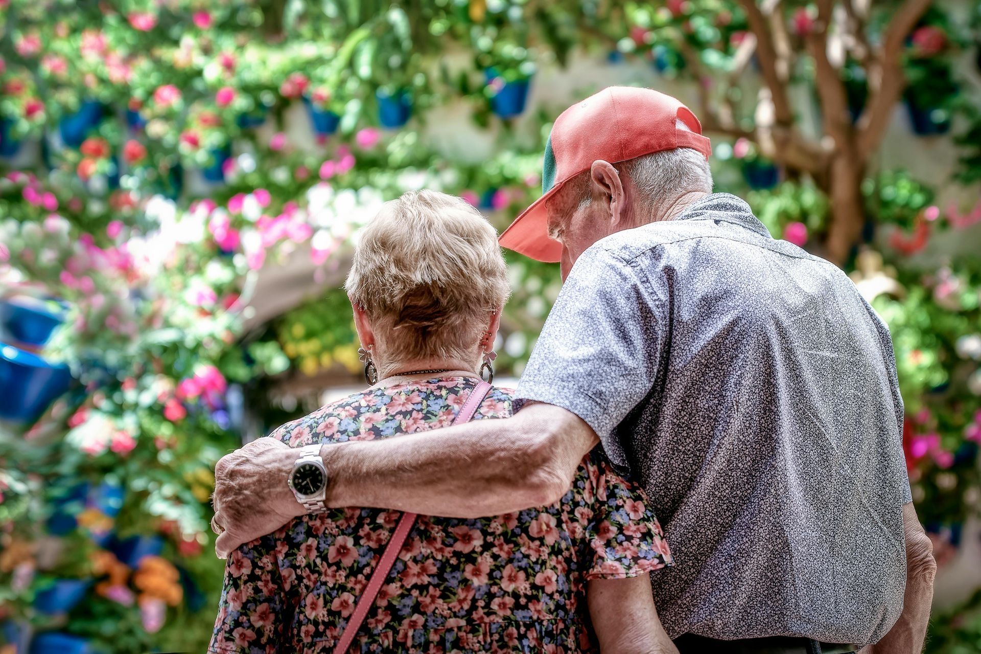 a nurse is talking to an elderly man and smiling .