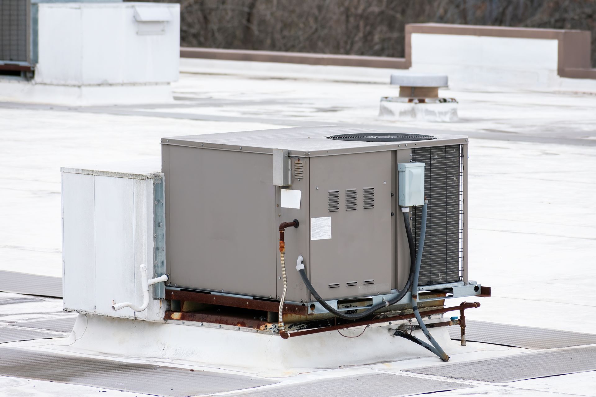 Commercial air conditioning unit installed on a building rooftop for climate control.
