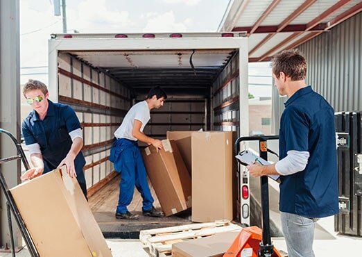 Storage Company — Workers Loading a Truck in St, Fayetteville, NC