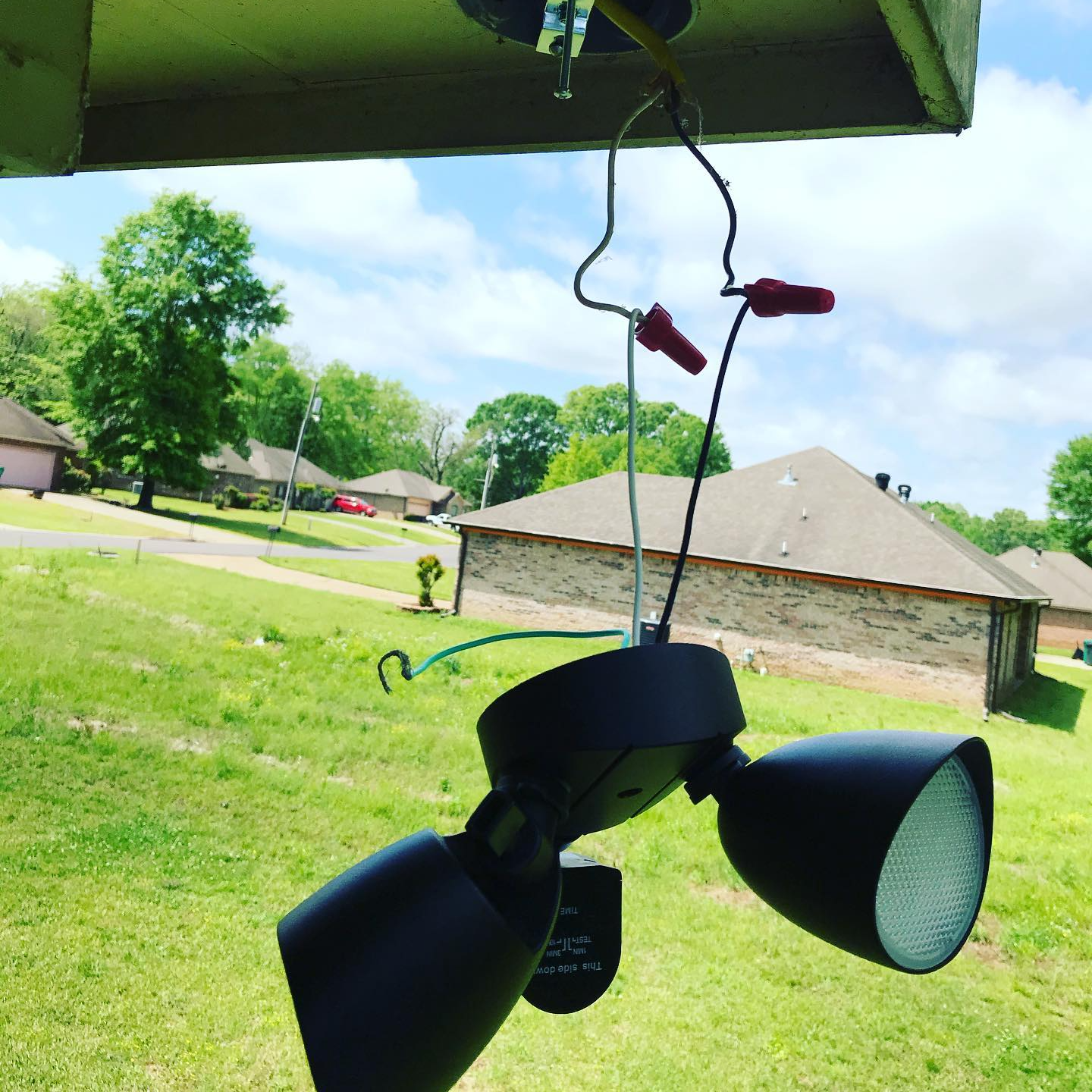 Outdoor lighting hanging in a gutter