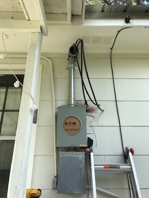 A ladder is next to a box that says e.t.n. on it