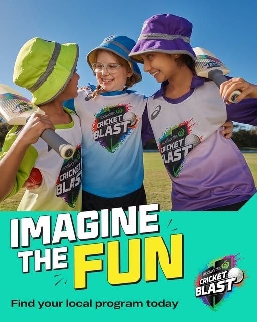 Three smiling children in Cricket Blast uniforms and hats stand together holding cricket bats outdoors.