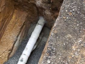 Trench with new pipe