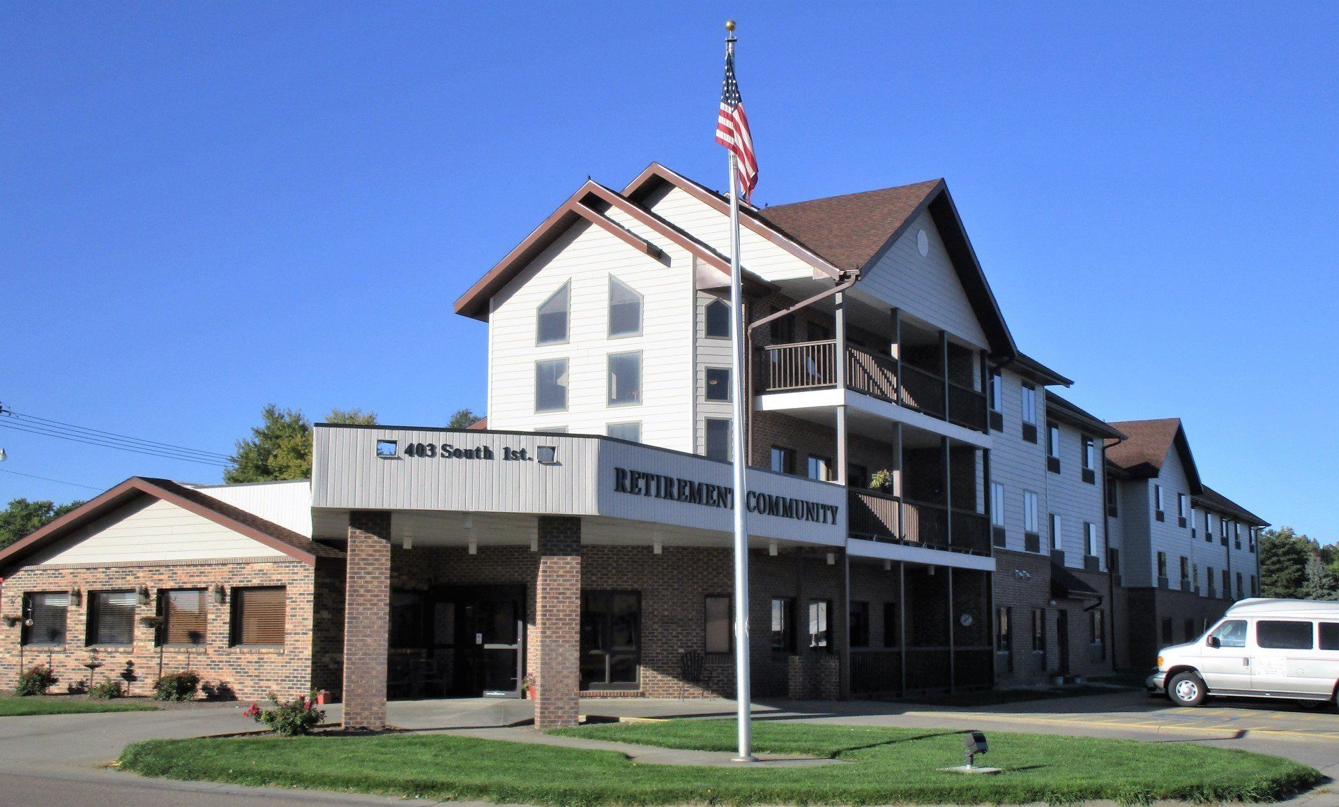 A large building with an american flag in front of it
