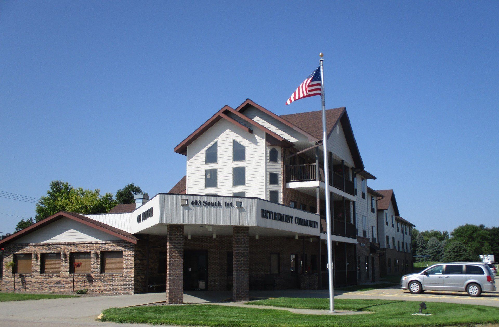 An american flag is flying in front of Off Broadway.