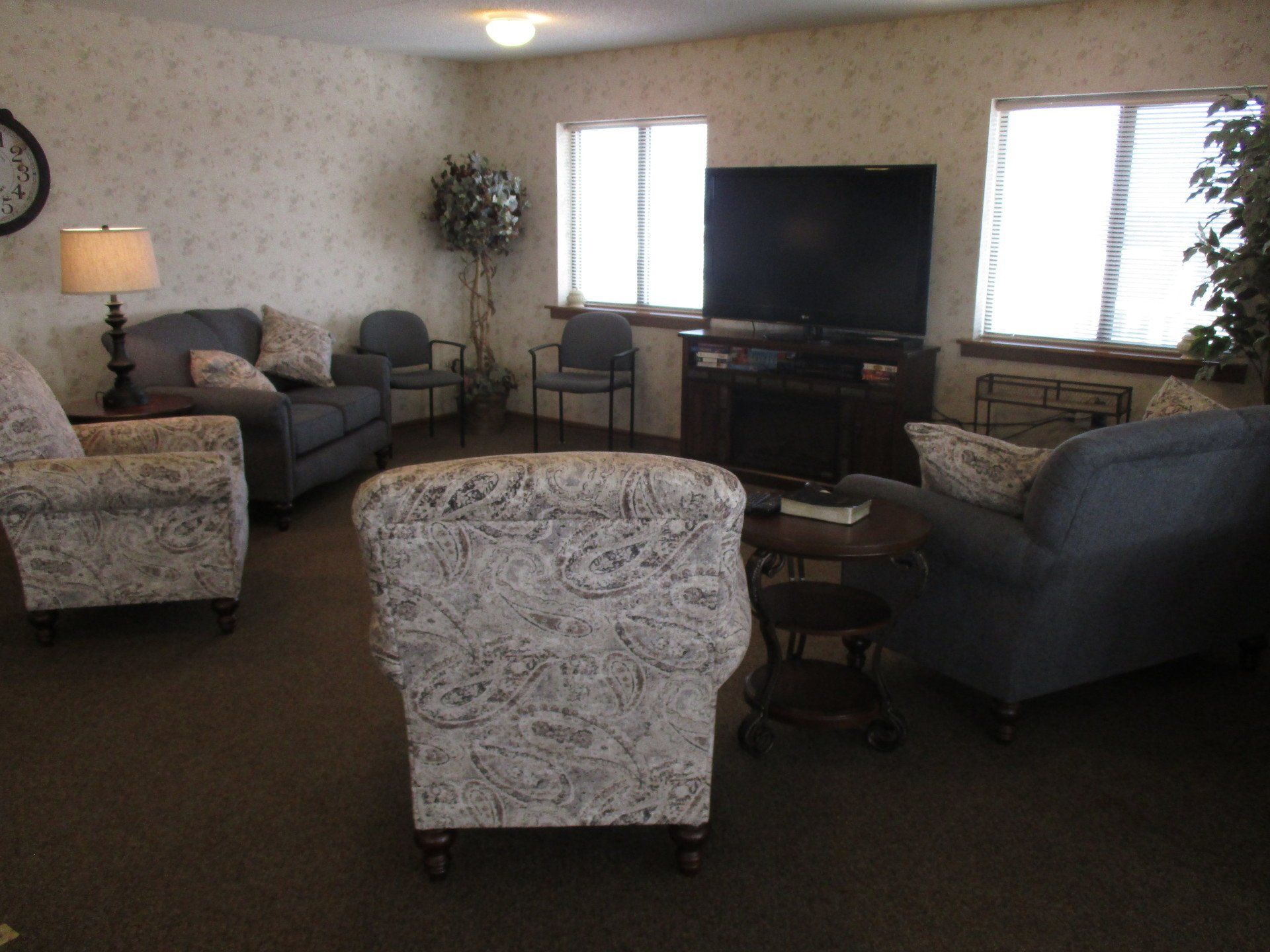 A living room filled with furniture and a flat screen tv