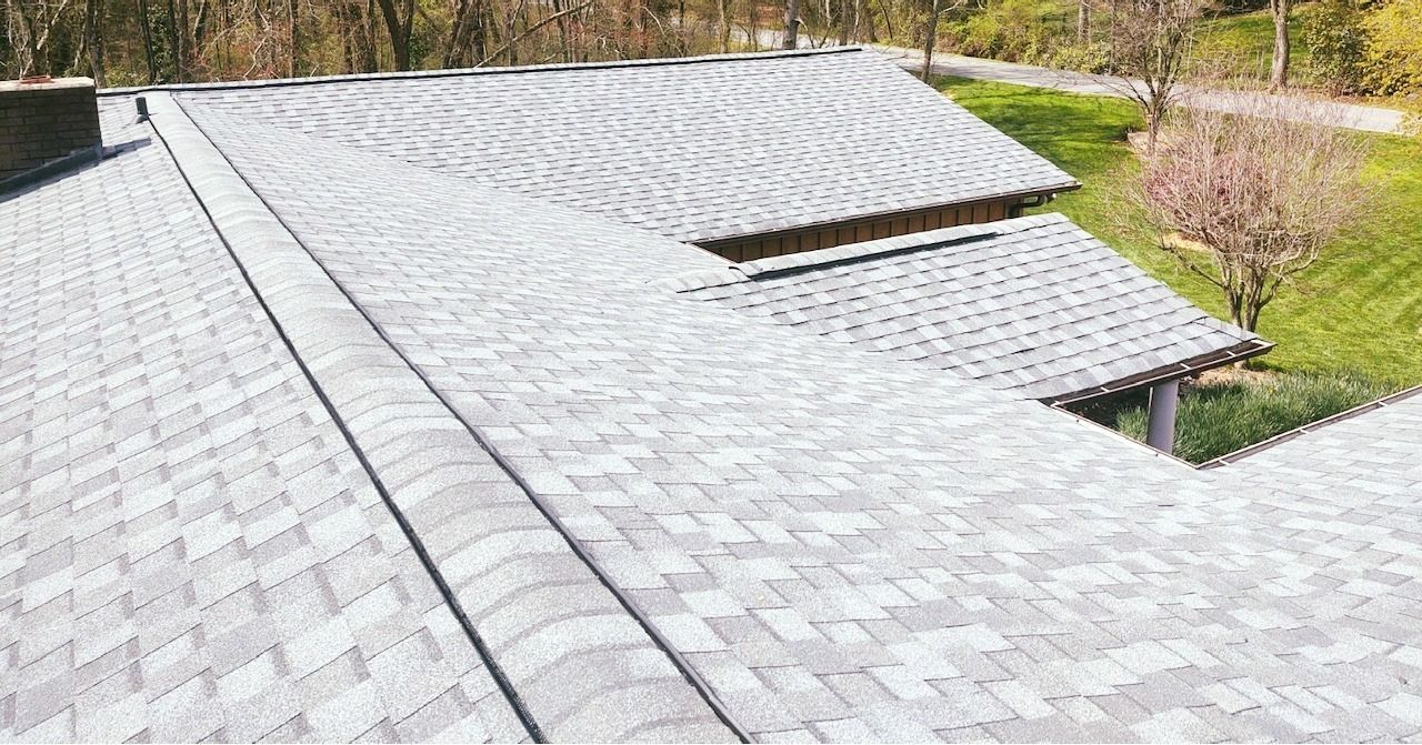 A close up of a roof with a lot of shingles on it.