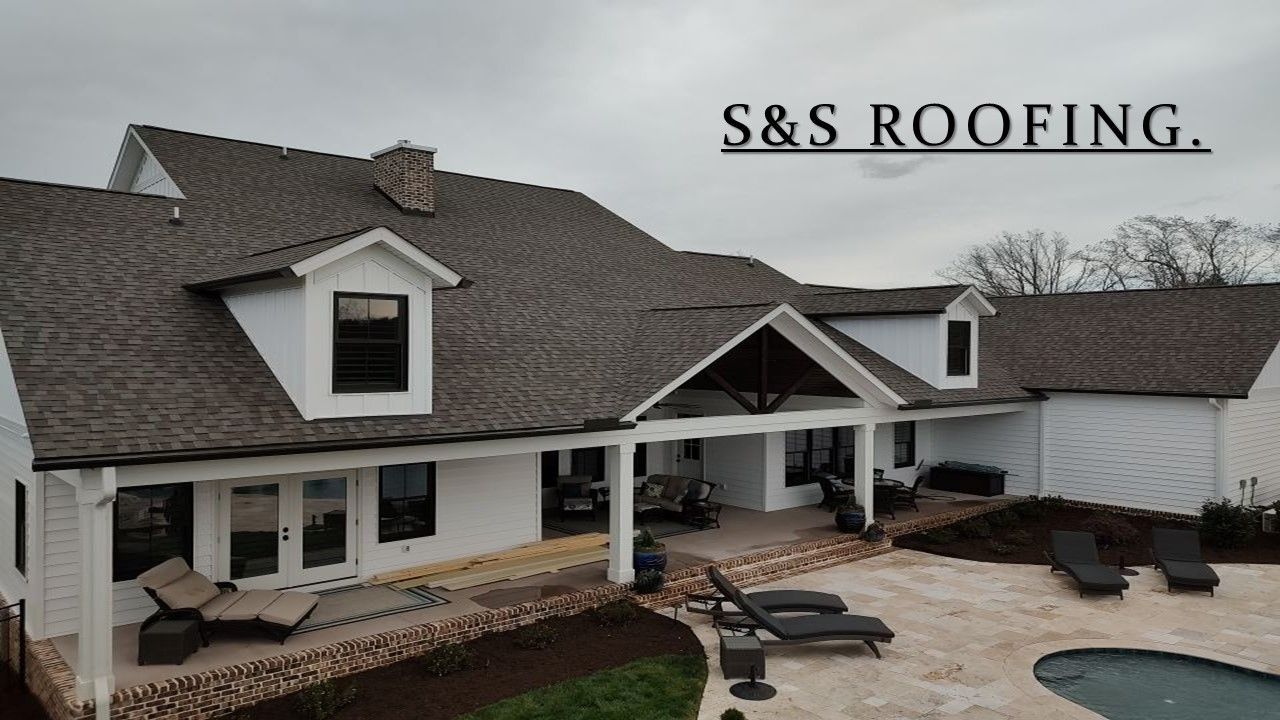 S & s roofing is advertising a house with a pool