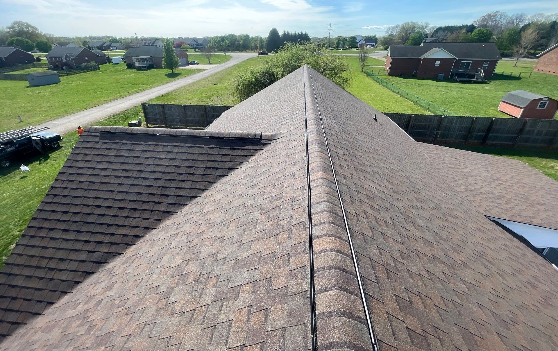An aerial view of a roof with a skylight on it