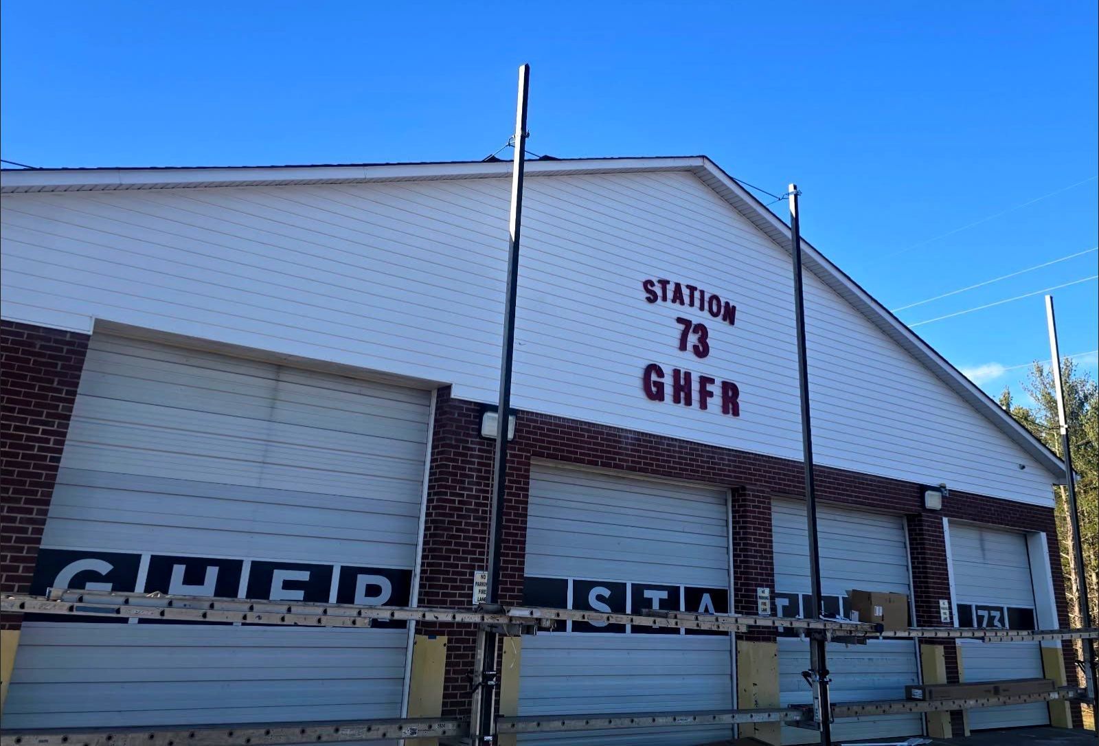 A white building with the number 73 on it