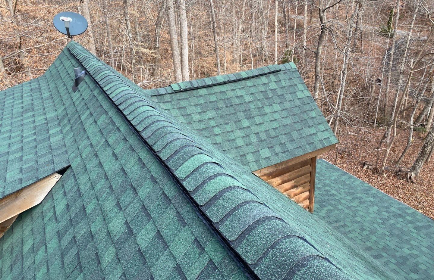 A green roof with a satellite dish on top of it.
