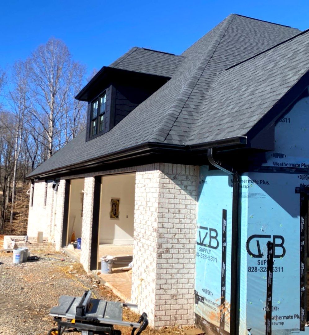 A house that is being built with the letters gb on the side