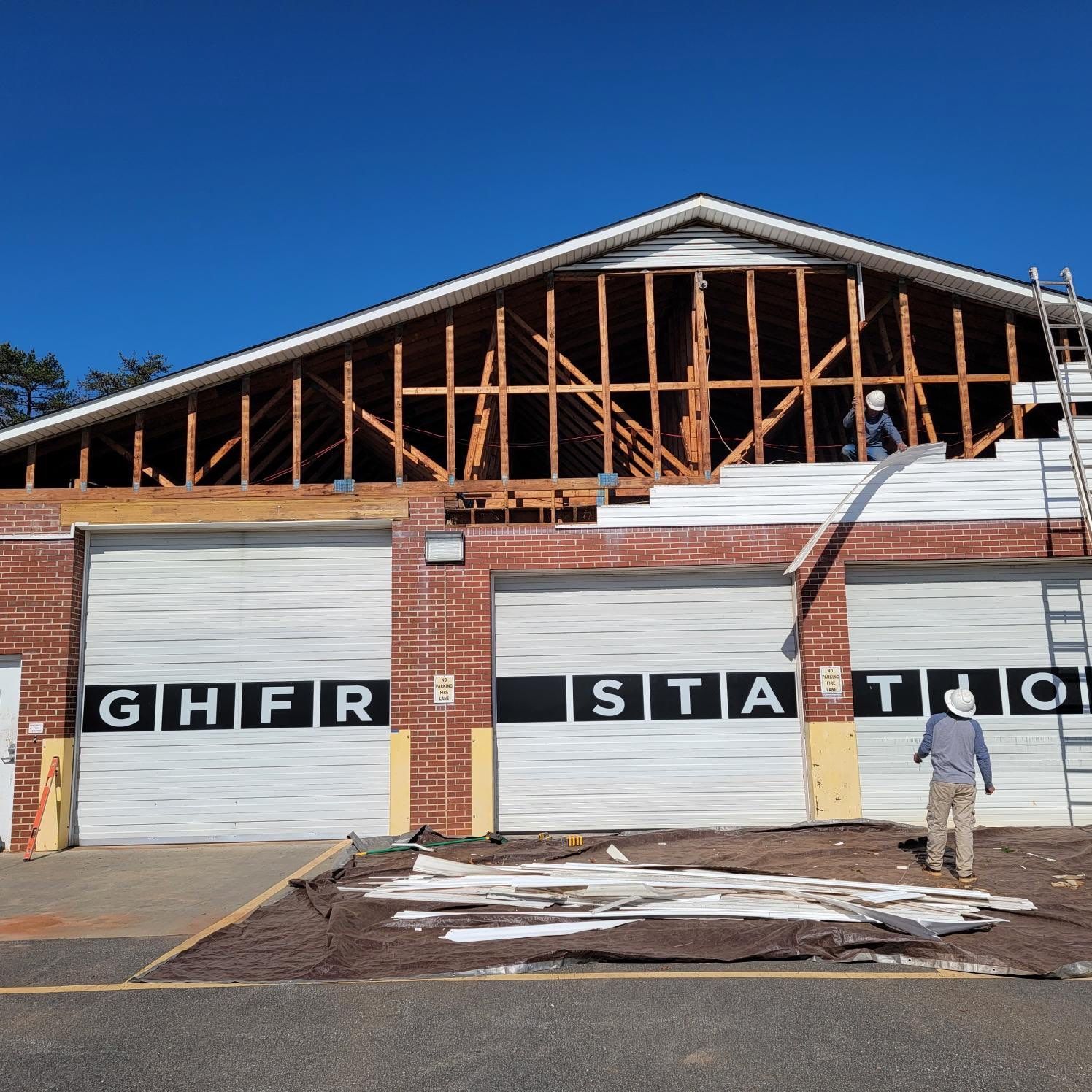 A man stands in front of a building that says ghfr static