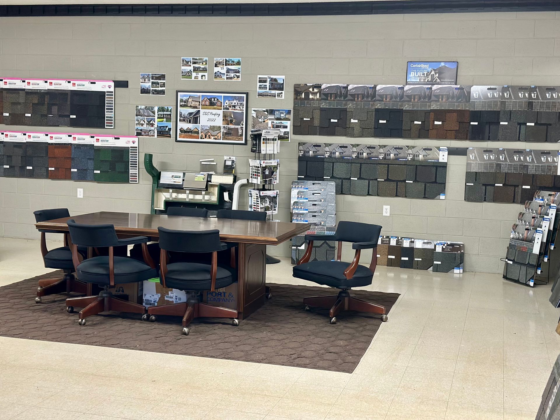 A room with a table and chairs in it