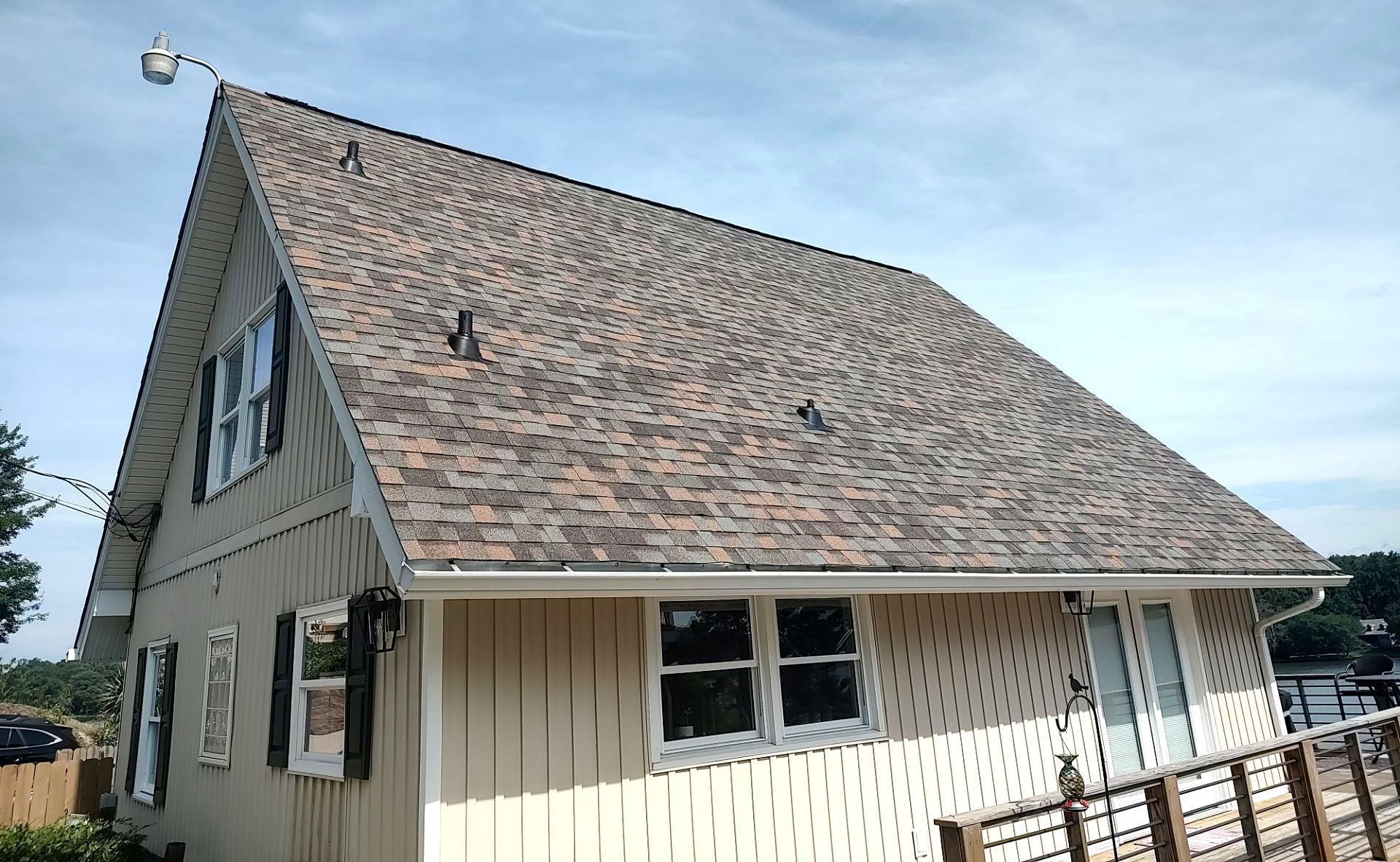 A house with a roof that has shingles on it