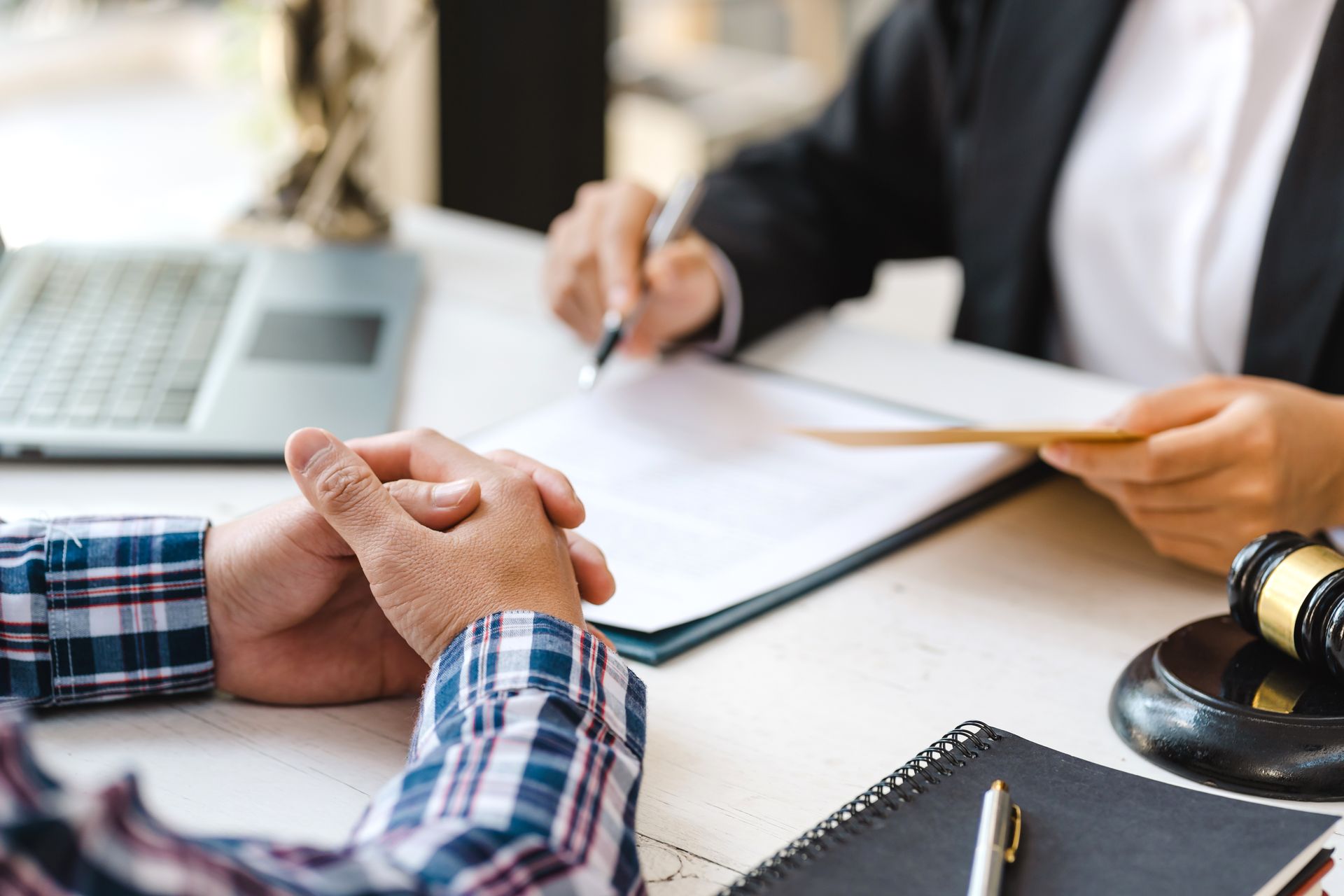 Employment attorney reviewing and signing workplace legal documents.