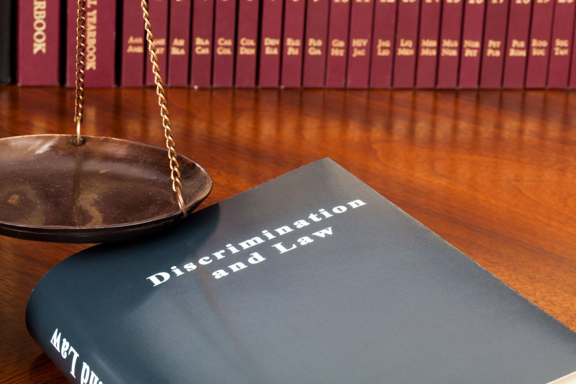 Justice and discrimination law represented by a gavel on a legal book Justice and discrimination law represented by a gavel on a legal book
