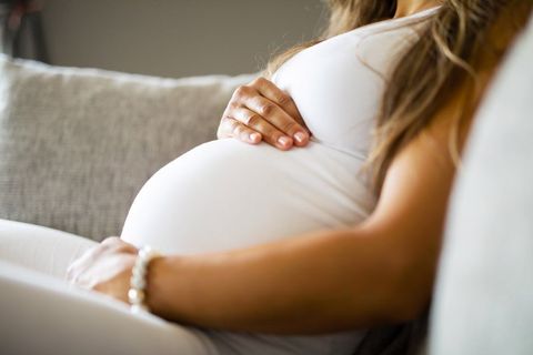 Close-Up of Pregnant Woman Sitting in Sofa — Birmingham, AL — Allen D. Arnold Attorney at Law