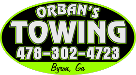 Orban's Towing logo: green and black oval with white text and phone number, "Byron, GA" at the bottom.