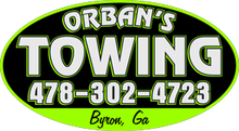 Orban's Towing logo: green and black oval with white text and phone number, "Byron, GA" at the bottom.
