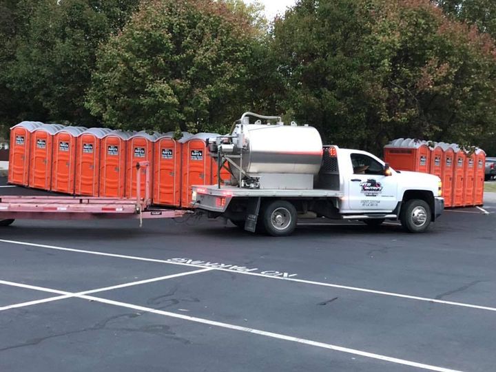 Woman Standing Next To A Truck — Owensboro, KY — Mitzi Autry's Portable Toilets Woman Standing Next To A Truck — Owensboro, KY — Mitzi Autry's Portable Toilets