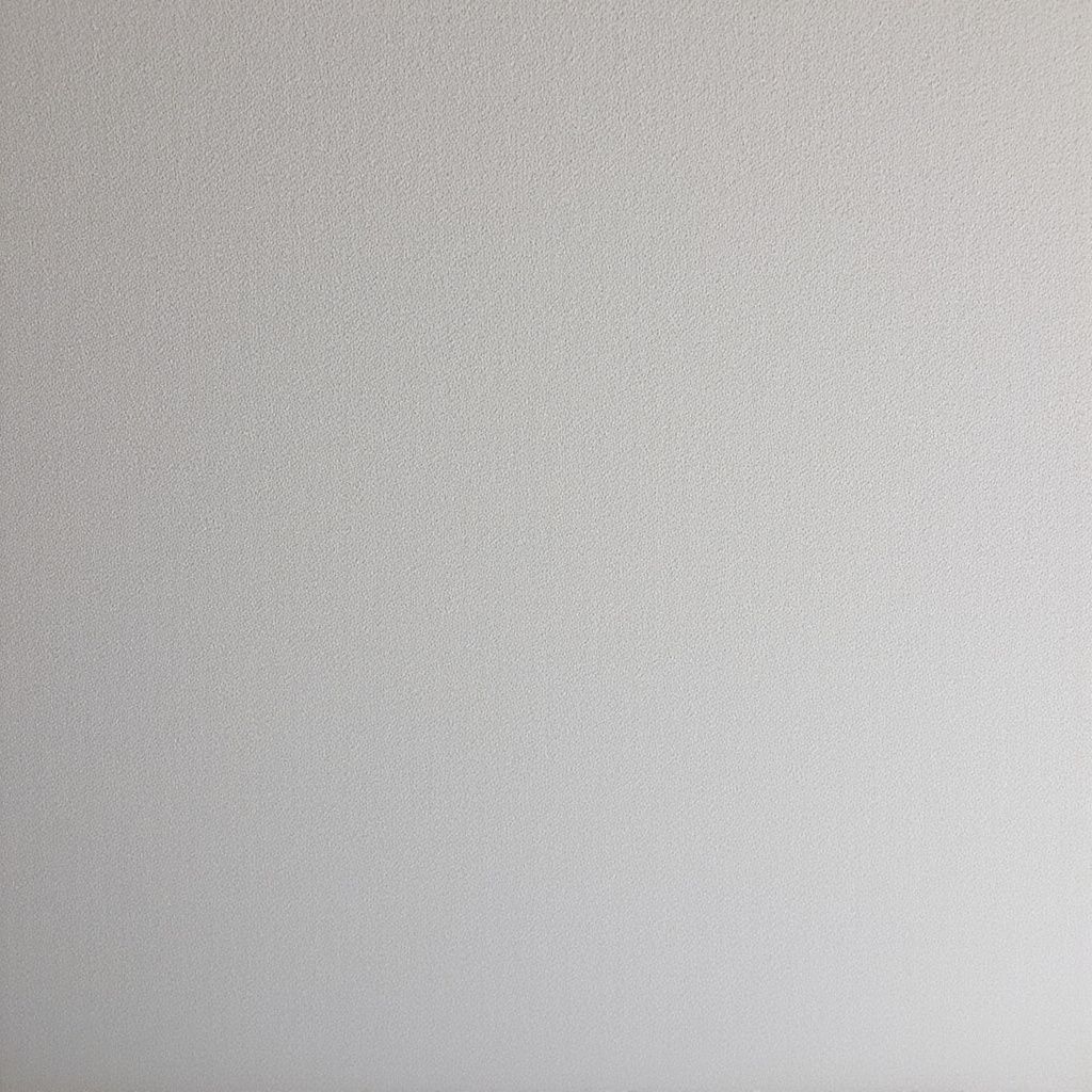 Off-white ceiling with speckled texture.