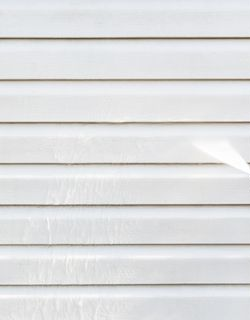 White horizontal siding on a house.