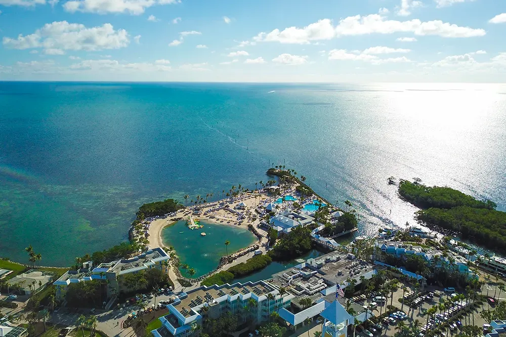 A group of boats are floating on top of a body of water.