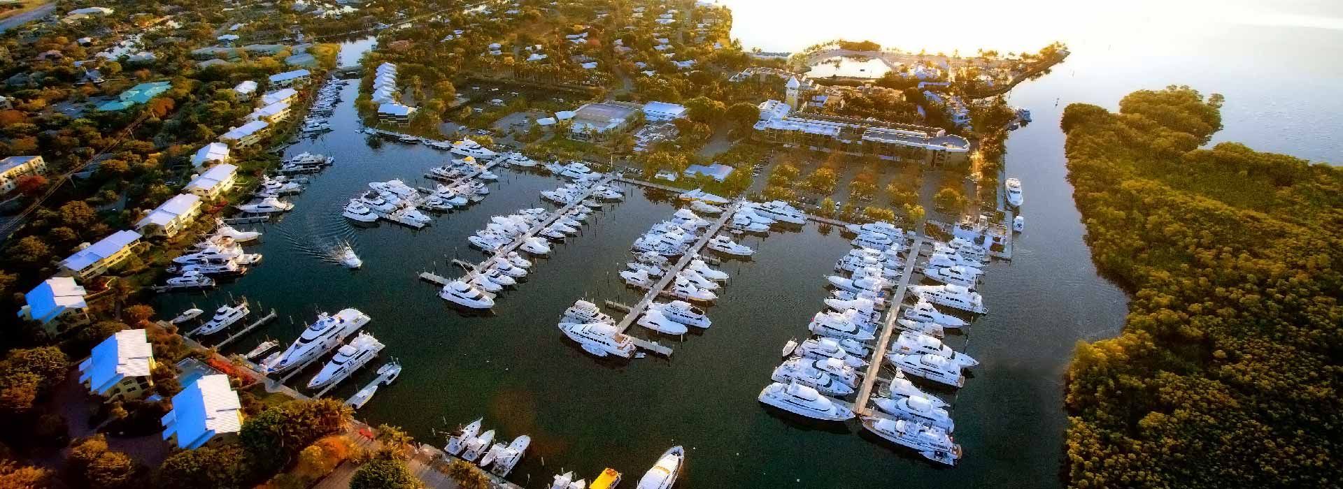 An aerial view of a marina with boats docked in it
