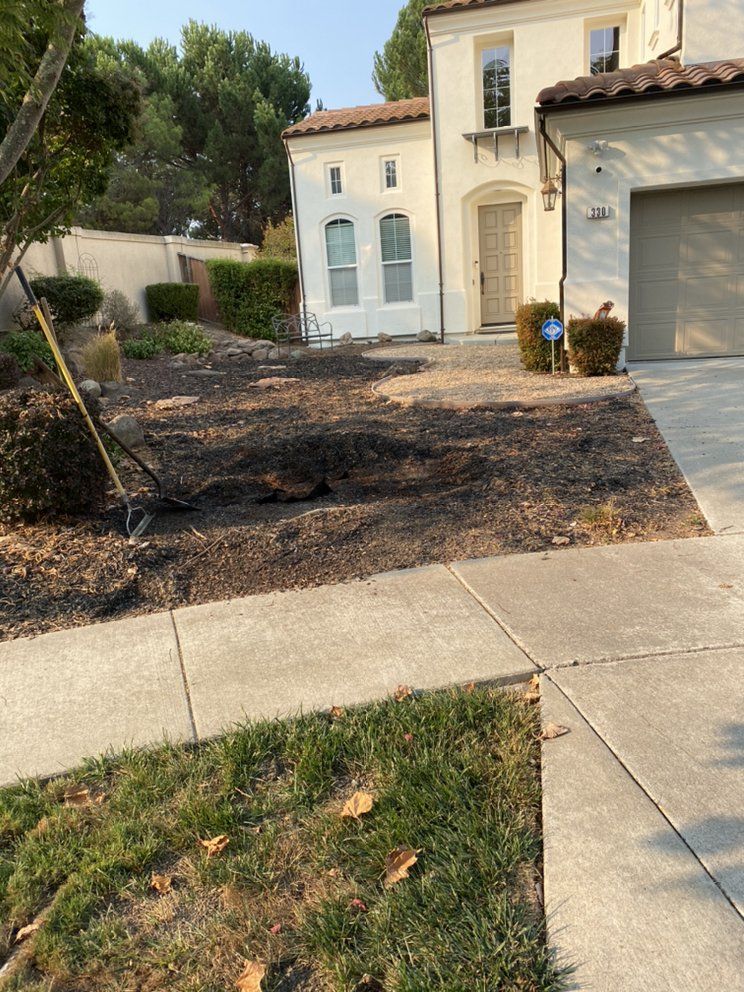 A house with a lot of dirt in front of it