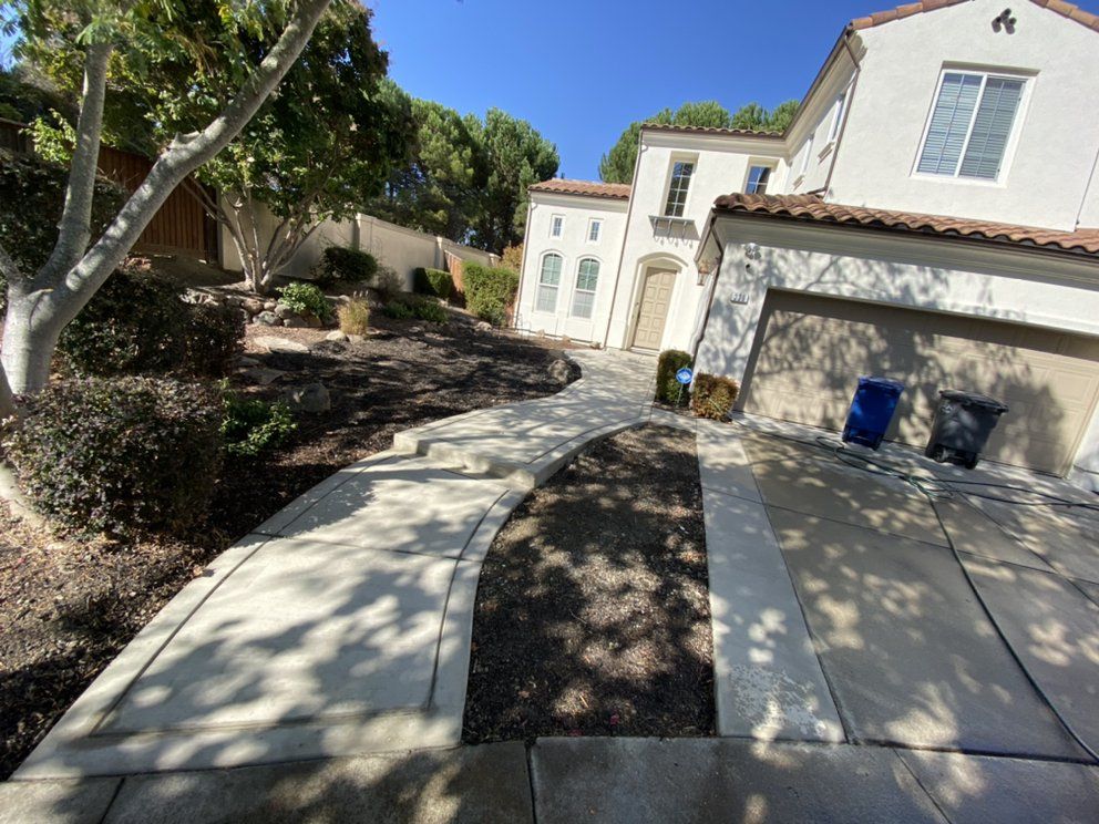 A white house with a walkway leading to it