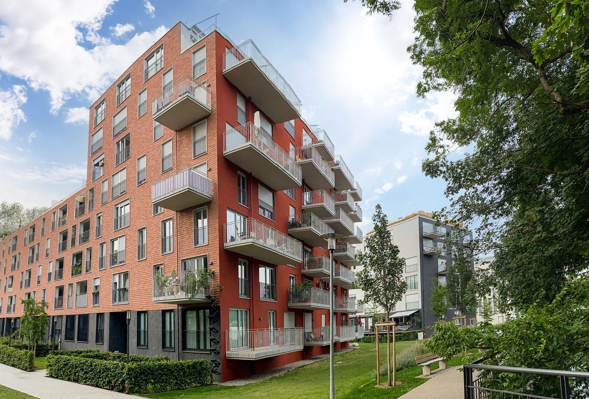 A large apartment building with a lot of windows and balconies