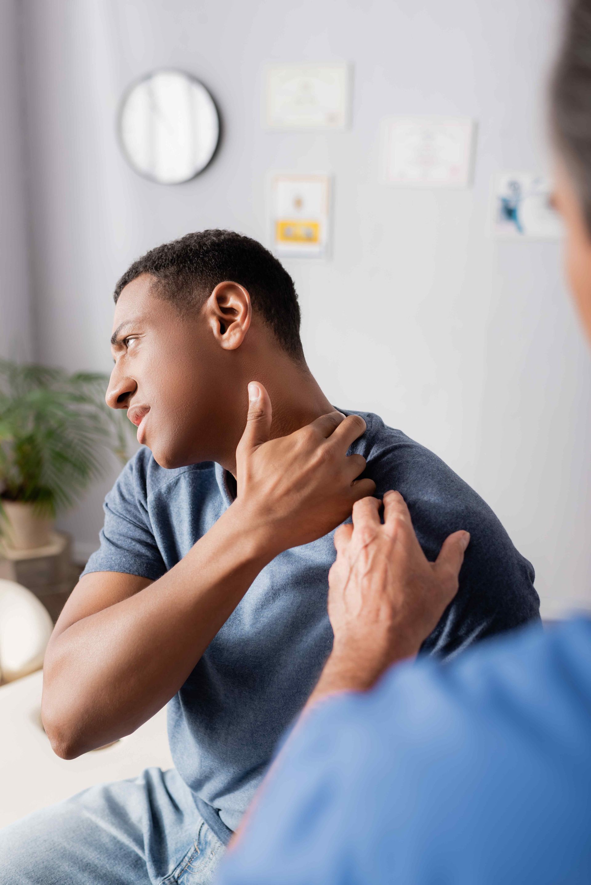 Patient Communicating with Chiropractor