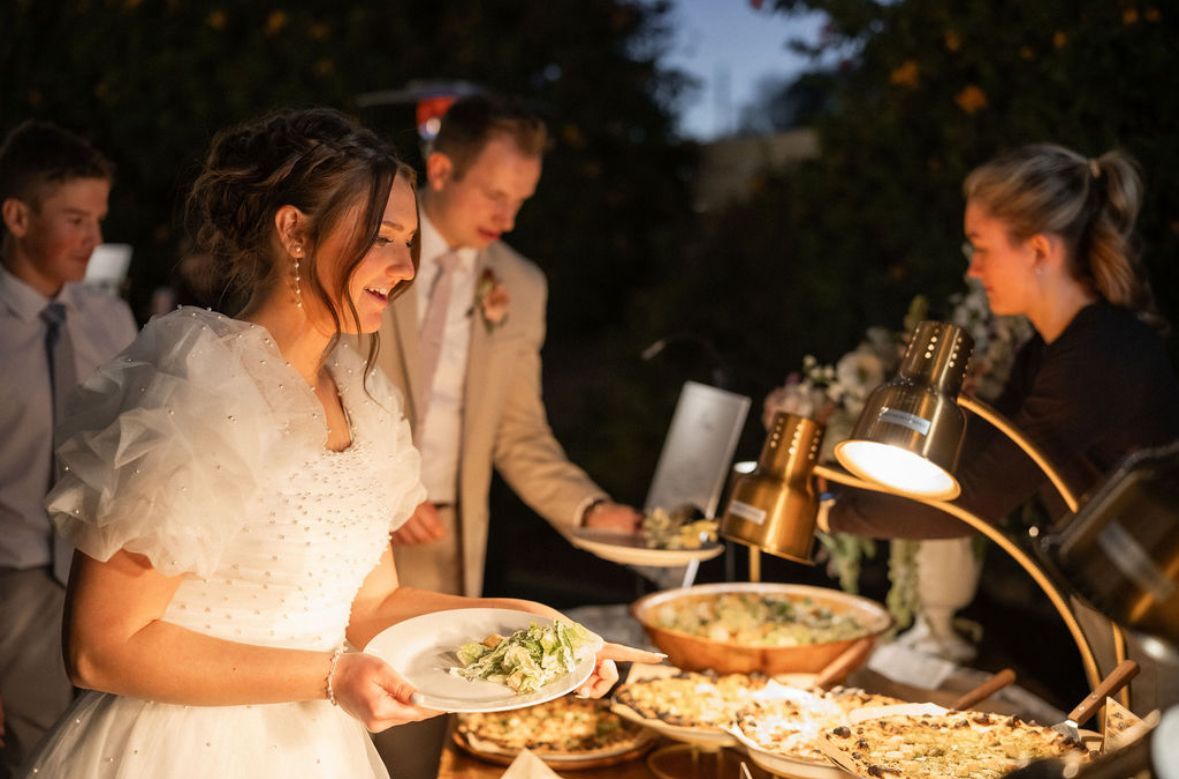 Wood-fired pizza catering serving guests quickly at a large outdoor event