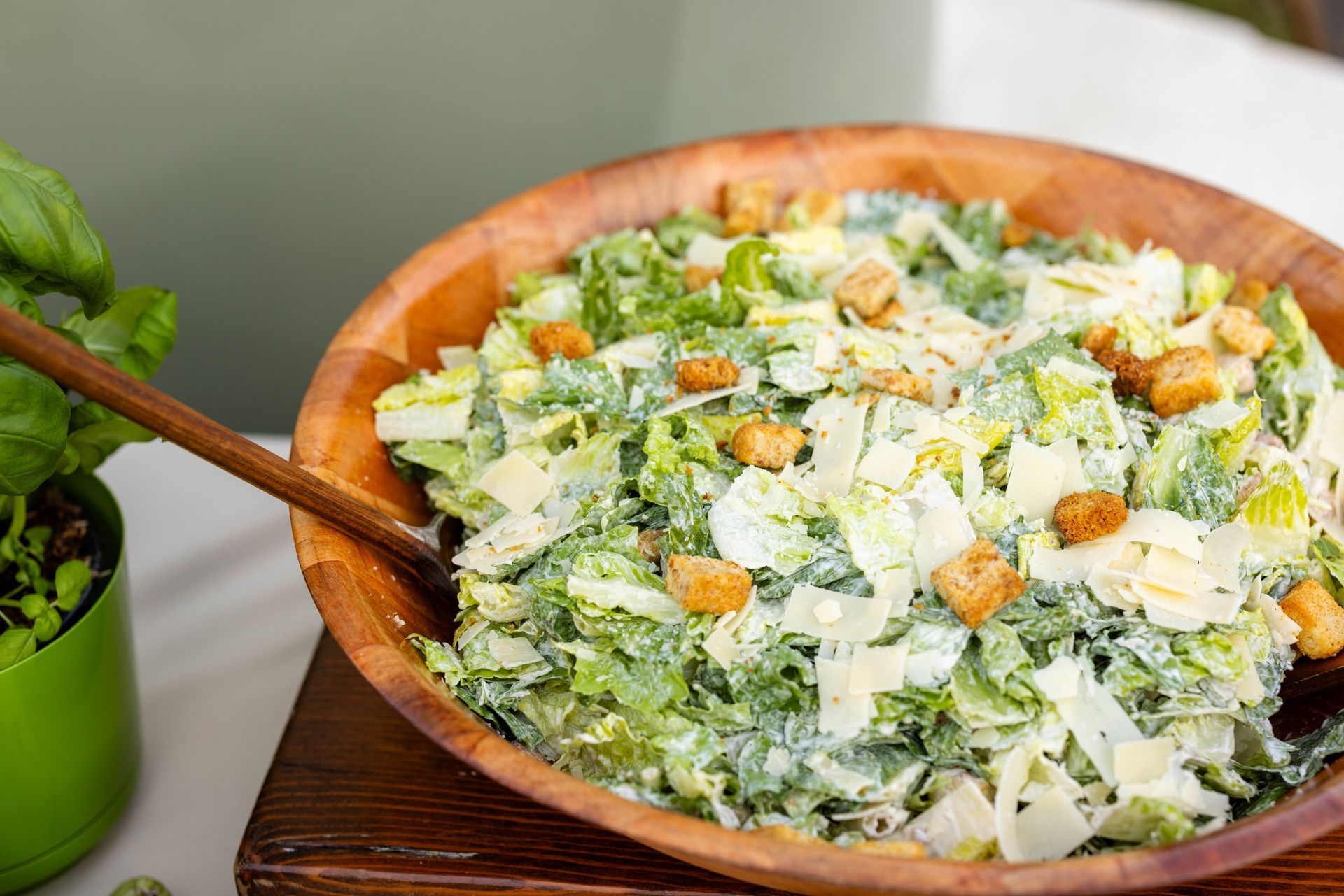 A bowl of salad with purple flowers and feta cheese