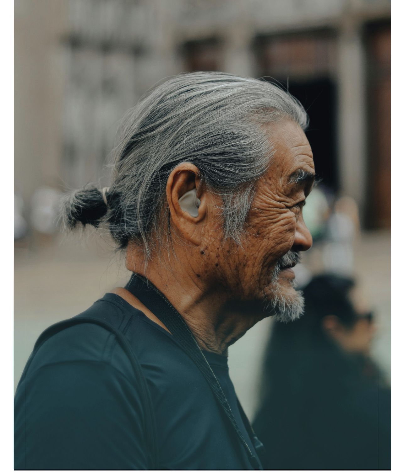 Close-up profile of an older man with grey hair, representing the future of audio streaming.