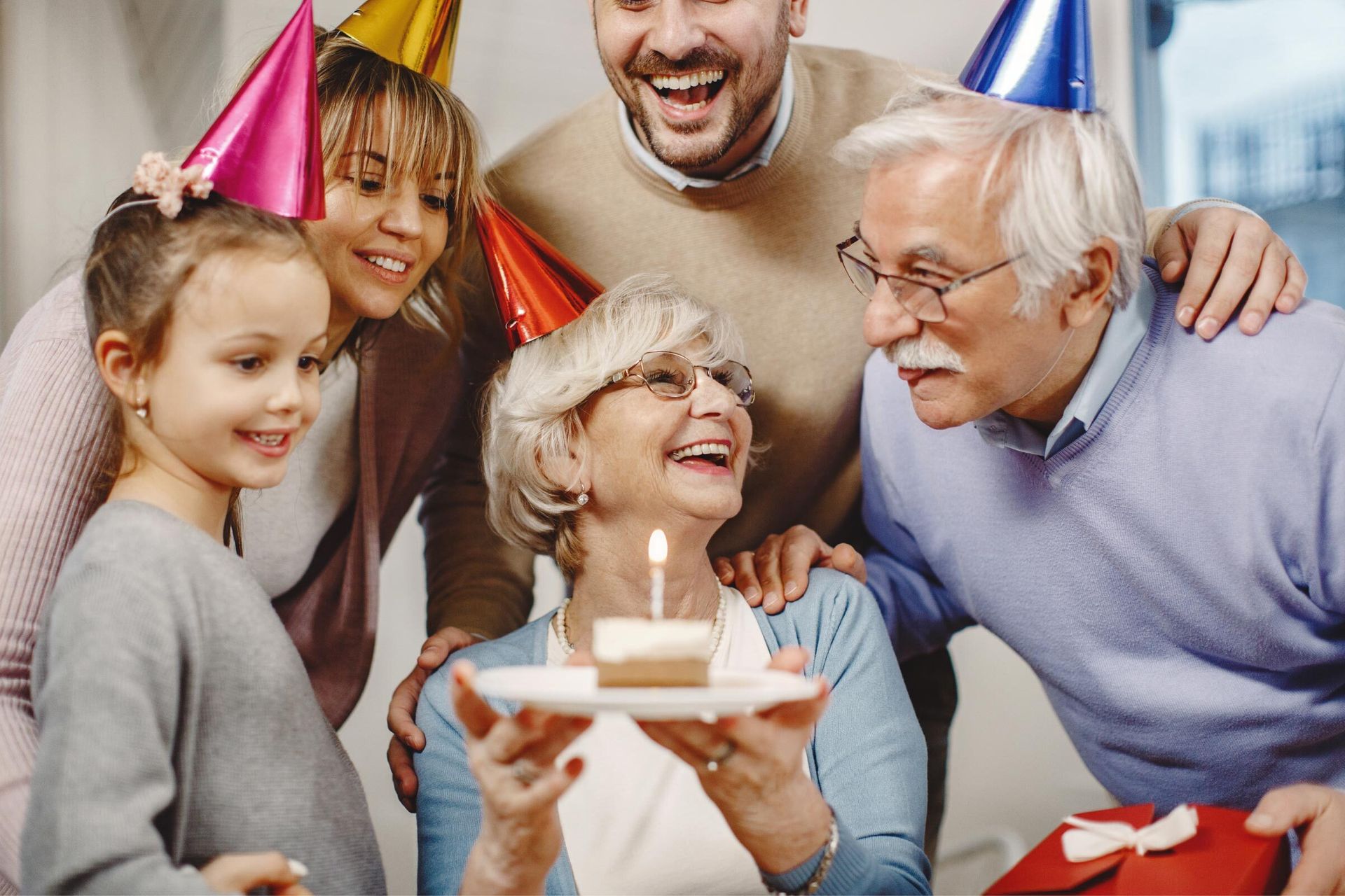 Family celebrating a birthday while highlighting the importance of hearing health.