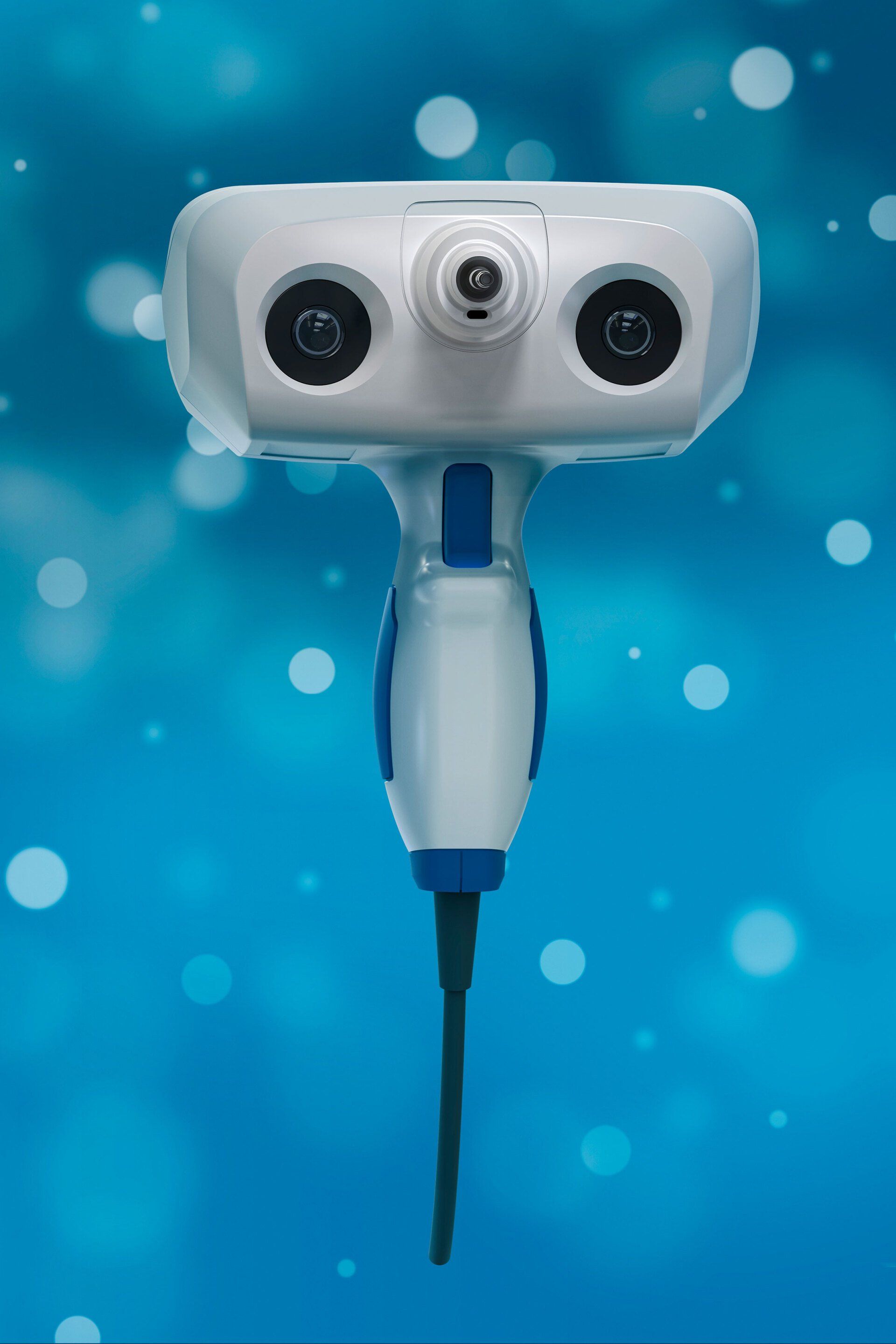 A white and blue camera is sitting on a blue surface.
