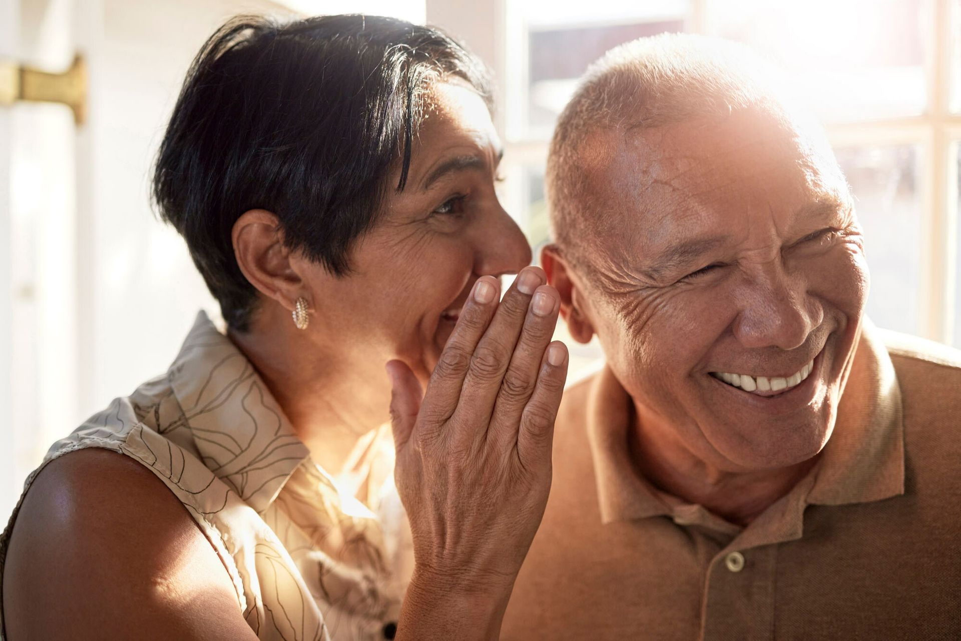 Happy elderly couple sharing a joyful moment together.