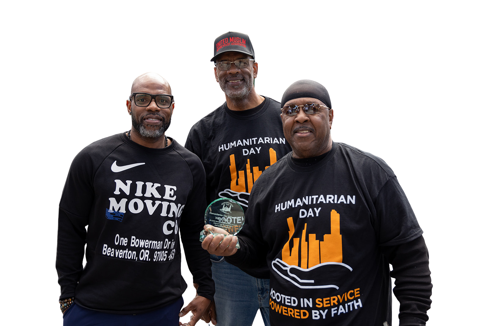 Three men are standing next to each other wearing black shirts.