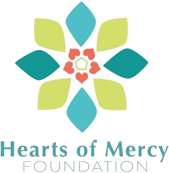 Logo for Hearts of Mercy Foundation: floral design in teal, green, and orange colors with the organization's name below.