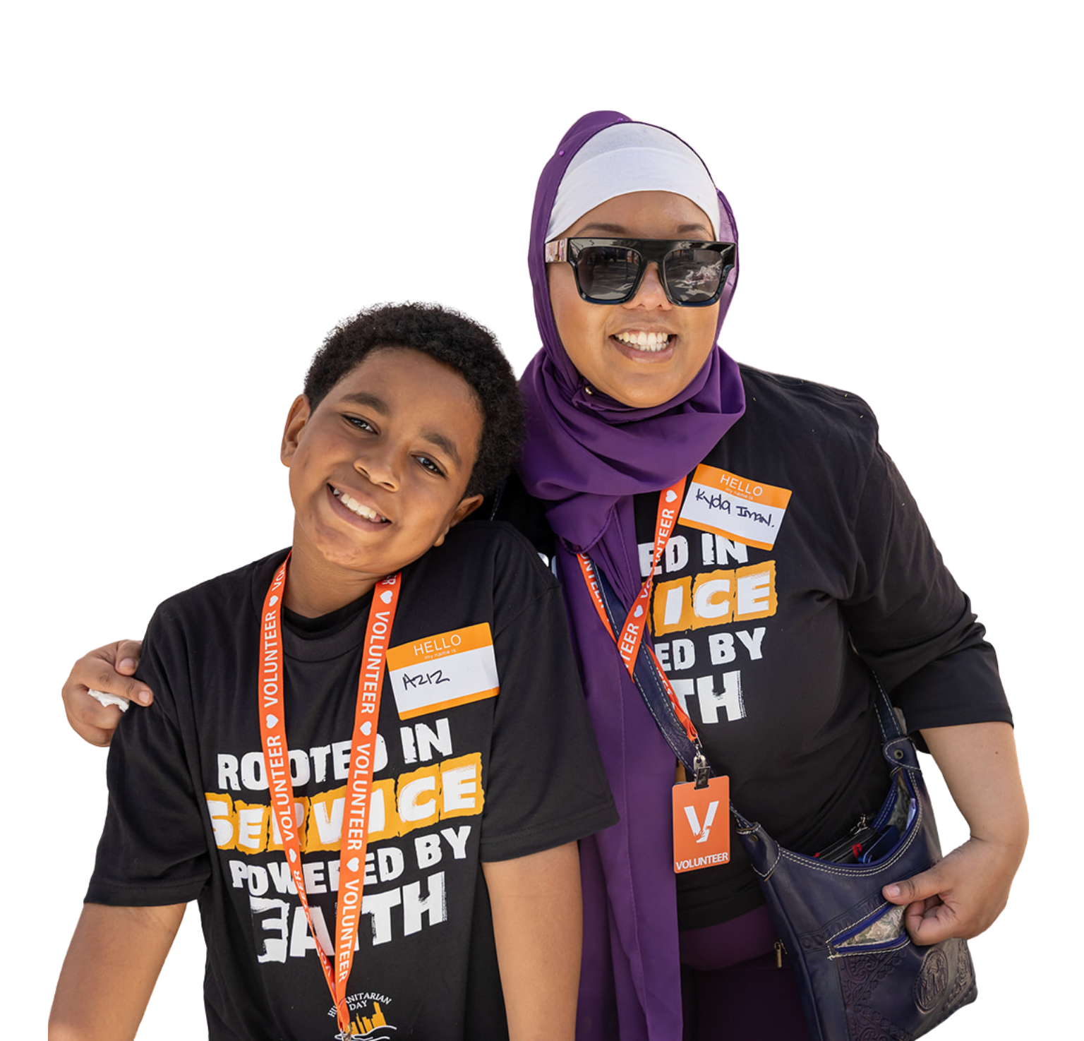 Three people smiling; wearing t-shirts, one with 