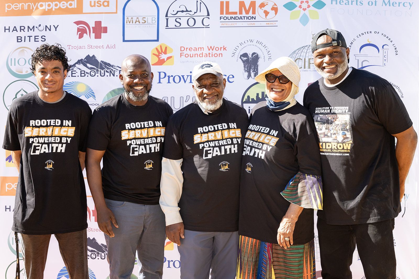 One man wearing Humanitarian Day t-shirt organizing food distribution